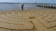 Baptist Minister's beach art creates intrigue 