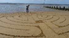 Baptist Minister's beach art creates intrigue